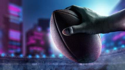 American football player holding the ball during the game in an American football stadium. Concept of sport