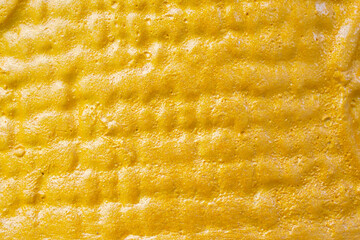 Gold ceramic surface texture background close up