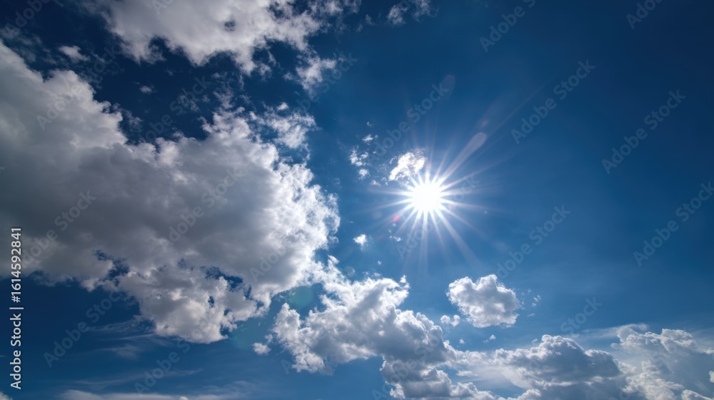 Poster sunlight streams through scattered clouds in a clear blue sky, creating a vibrant atmosphere. the sc