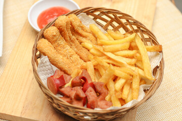 close up french fries with sausages and nugget stick