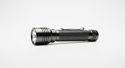 Black metal flashlight isolated on white background