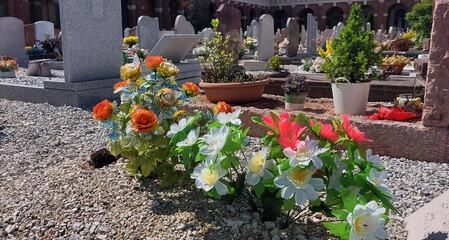 flowers for decoration of the beloved deceaseds grave in the cemetery