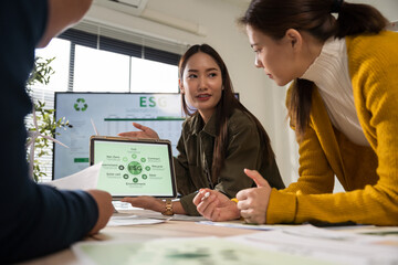 Asian business leaders meet to strategize on implementing sustainable practices, focusing on reuse, recycling, and environmental protection for a greener future © saksit