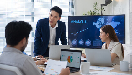 Creative business team meeting to brainstorm innovative ideas for a new venture, showing teamwork,...