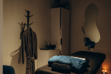 Cozy Spa Room Ambiance With Towel and Bathrobe Arrangement