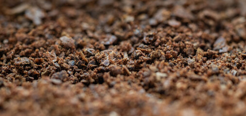 Close-up of ground cloves. Brown texture of aromatic spices.