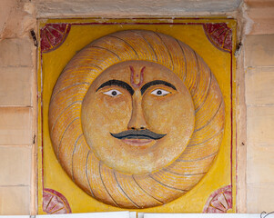 Traditional Sun Face Artwork on Temple Wall in Pushkar, India