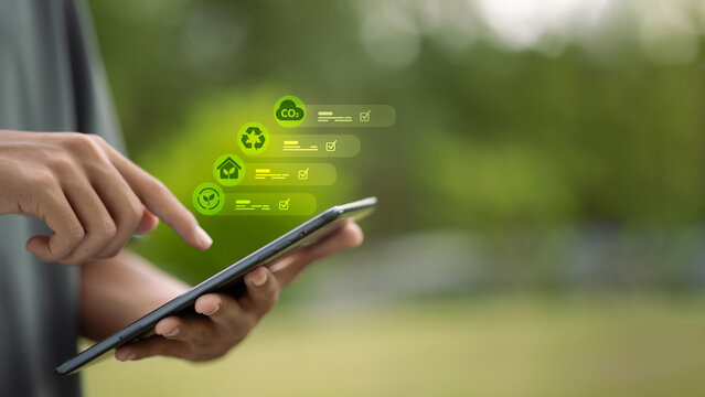 Green technology dashboard with ESG icons on digital tablet
