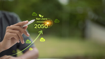 Net zero 2050 CO2 reduction goal with upward graph and stylus