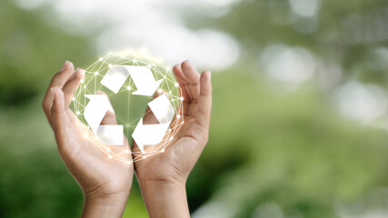Recycling Symbol in Hand with Eco-Friendly Digital Network
