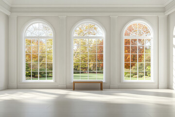 Bright and spacious room with large windows showcasing fall foliage in a serene landscape setting