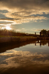 Canal lock gate on the Shropshire Union canal,. England, in early evening sunlight. Inland waterway holiday concept.