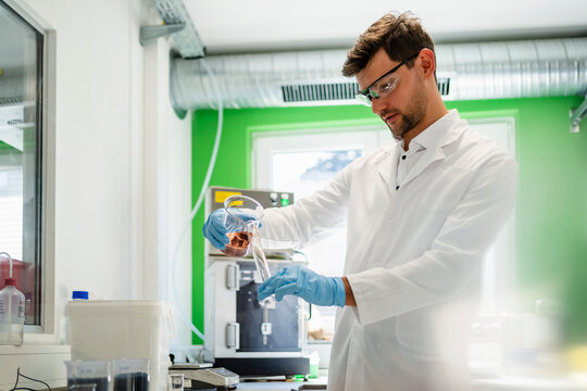 Scientist practicing thermolysis experiment in laboratory