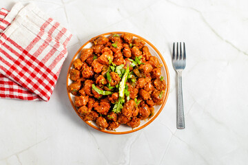 Chilli soyabean is a spicy, tangy Indo-Chinese dish made with crispy soyabean chunks stir-fried in...