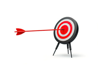 A vibrant red arrow perfectly strikes the center bullseye of a black, white, and red target on a stand, symbolizing achievement and precision.