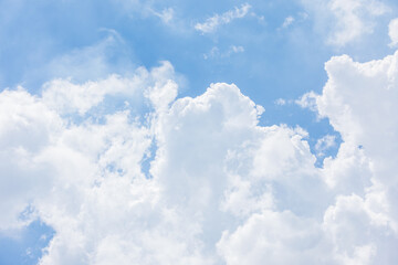 Fluffy White Clouds in a Bright Blue Sky.
