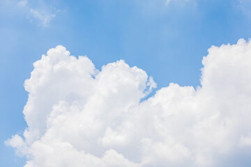 Fluffy White Clouds Floating in a Clear Blue Sky