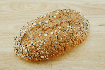 Whole Grain Bread Freshly baked bread topped with flax seeds and sunflower seeds