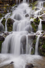 Waterfall Cascading Over Mossy Rocks with Smooth Water Effect