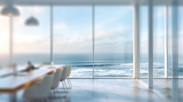 Fototapeta Bright dining area features a large table and chairs with panoramic ocean views. Waves can be seen crashing against the shore, creating a peaceful, inviting atmosphere.