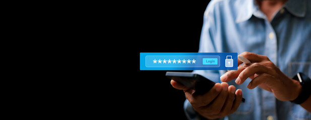 Close-up of a man using smartphone with virtual password input and login button. Concept of secure...