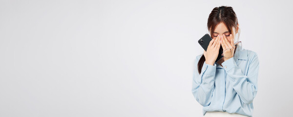 Vision problem Young Asian woman rubbing eyes from fatigue, vision blurred after using glasses,...