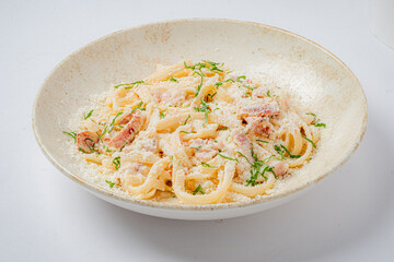 Creamy fettuccine with cheese and herbs highlights culinary artistry and flavor
