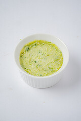 Creamy butter blended with vibrant herbs, ready to elevate any dish with freshness and flavor
