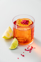 A vibrant cocktail features citrus slices and a delightful garnish, perfect for warm days