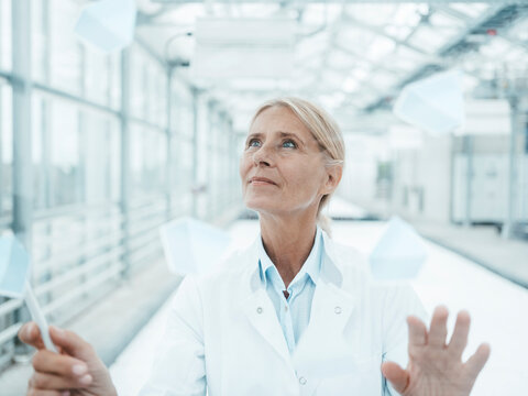 Biologist working on translucent screen at industry