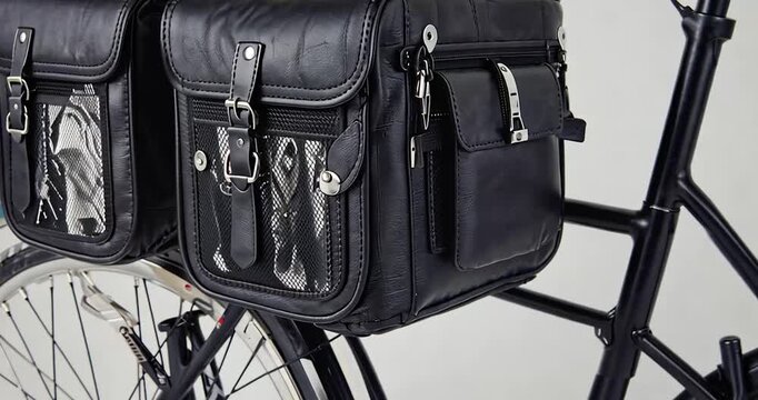 Black bicycle panniers with leather design