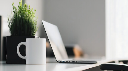 Minimalist Office Desk with Laptop, Coffee Mug, and Potted Plant