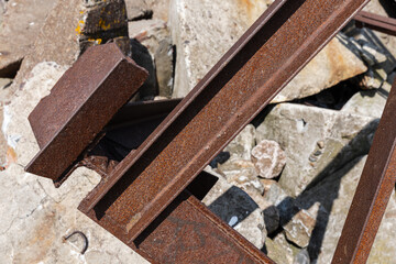 Close-Up of Rusty Metal Beams on a Rocky Background