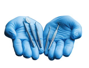 Dental tools held in gloved hands (2)