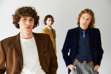 Stylish young friends showcase fashion choices in a modern setting with confidence and flair