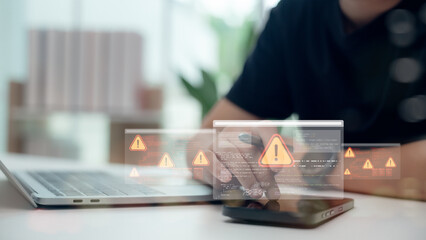 Cybersecurity concept with alert notification symbols on screen. Close-up of programmer detecting...
