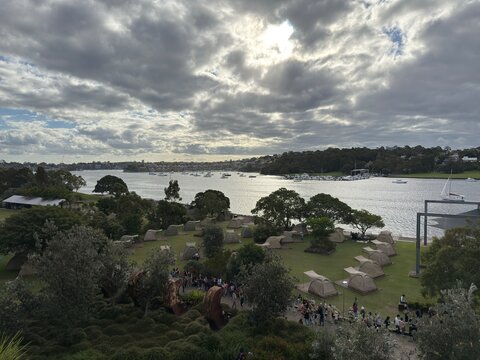 View of glamping tents on the ground next to the harbour, Cockatoo Island, Sydney, Australia