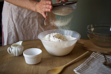 Sifting the white flour, making dough for home baking