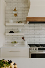 Modern farmhouse kitchen with tile and open shelving