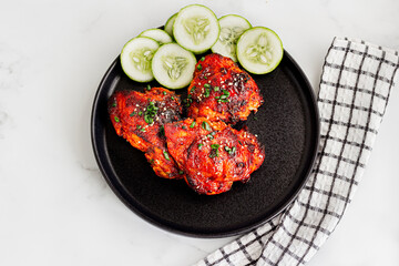 Sticky Gochujang Chicken Thighs on a Plate Top Down Flat Lay Photo
