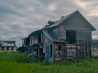 abandoned old wooden house in a northern village in Russia