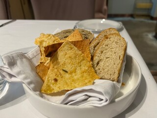 a basket of some bread as a appetizer