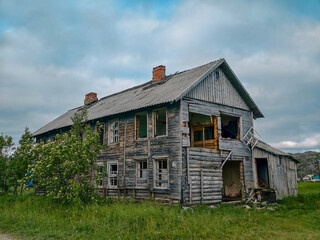 abandoned old wooden house in a northern village in Russia
