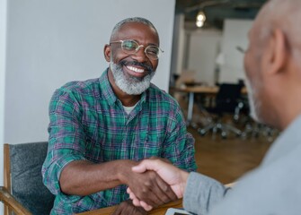 Business meeting highlights happy man shakes hands with boss in modern office setting