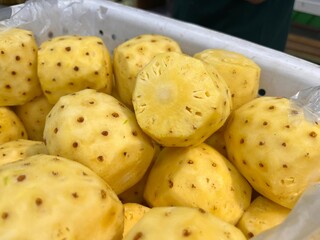 close up of a pile of pineapples