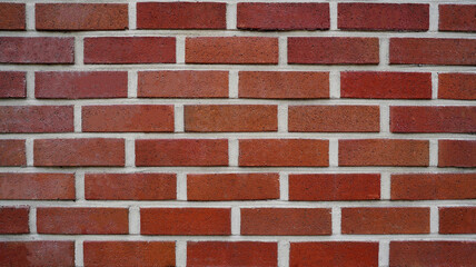 Clean Red Brick Wall with Uniform Pattern and Textured Surface