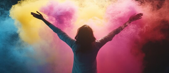 A silhouette of a dancing woman with hands holding flowers, arms outstretched in the sun, embodying freedom and happiness
