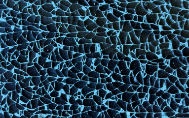 Broken tempered glass closeup texture background. Glass pattern. Cracked broken destroyed glass damaged window background