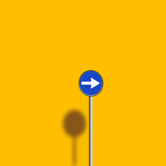 A simple blue one way traffic sign on a bright yellow background. The long shadow adds depth to the flat design, representing urban street elements in a minimalist visual style.