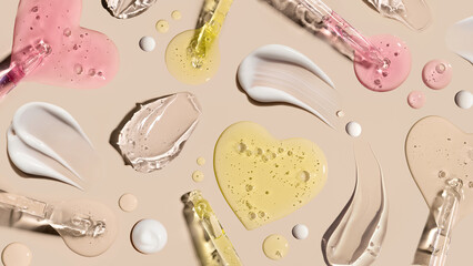 samples of cosmetic care products smear of cream texture on a beige background